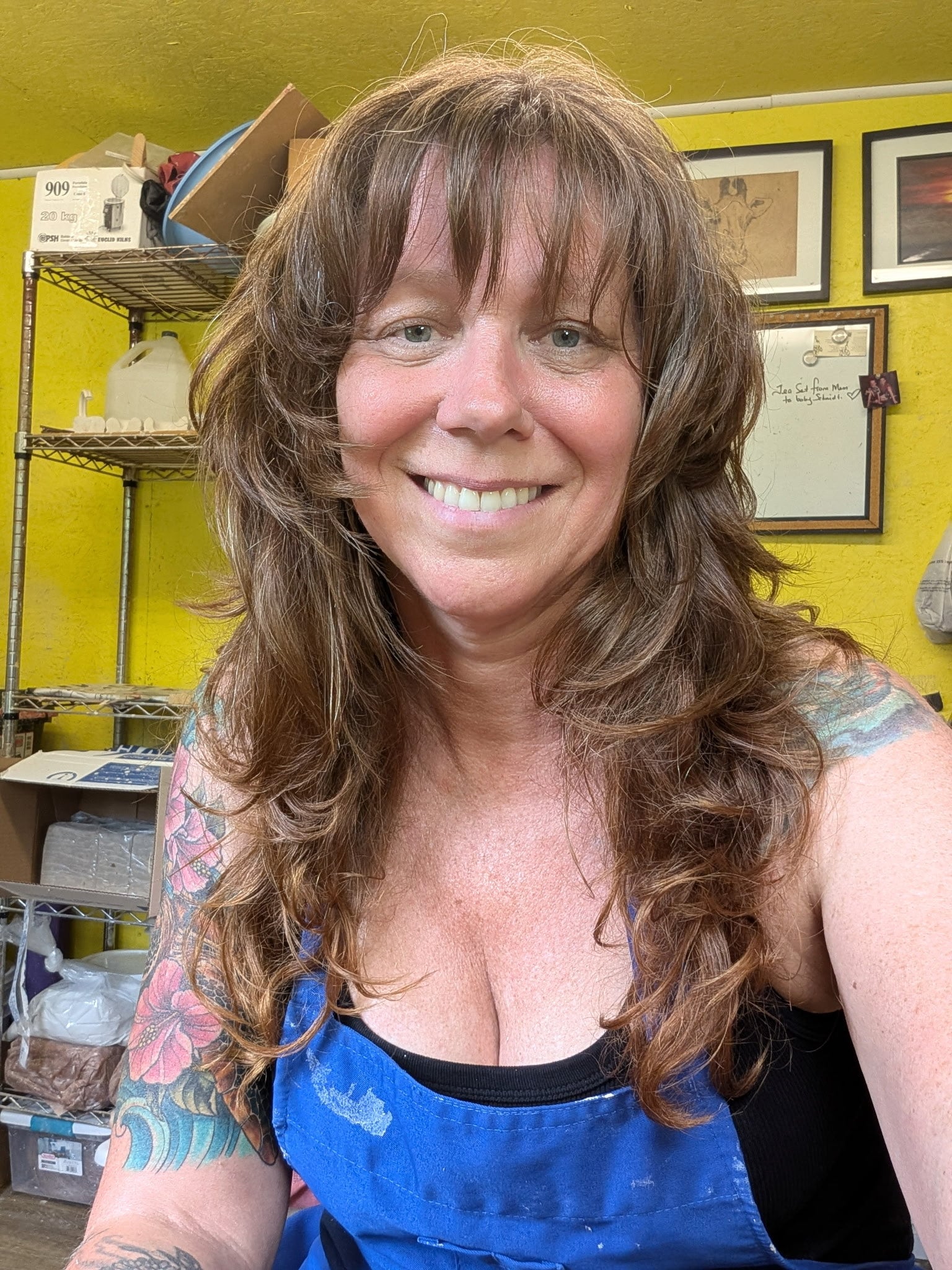 Karen smiling in her pottery studio at Shaw Hill Pottery